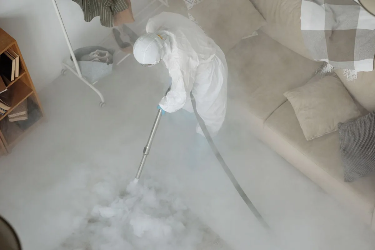 Biohazard cleanup technician in protective equipment, Yardville, NJ